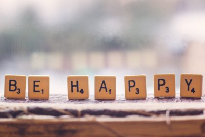 BE HAPPY written with scrabble pieces